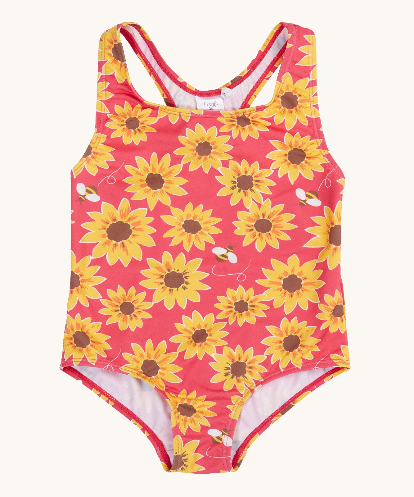 Frugi recycled plastic swimsuit laid flat. In pink with a repeating yellow sunflower and bee design.