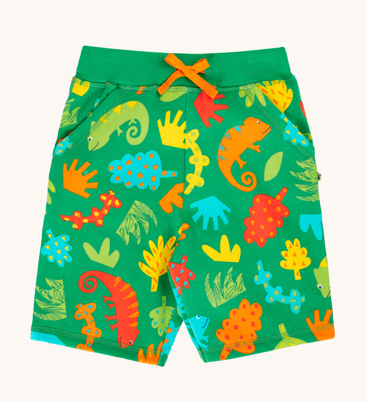 Frugi samson printed shorts laid flat. In bright green with a repeated chameleon and leaves print. Features a orange waist tie