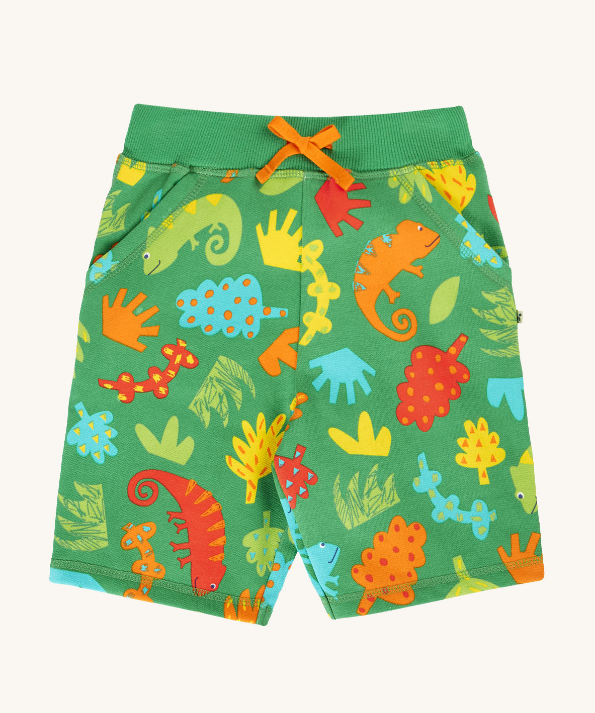 Frugi samson printed shorts laid flat. In bright green with a repeated chameleon and leaves print. Features a orange waist tie