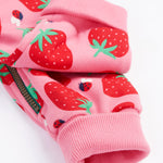 Frugi kids snuggle suit in strawberry design leg cuff detail