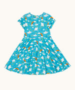 Frugi organic cotton skater dress laid flat. In light blue with a repeating grey manta ray and rainbow print