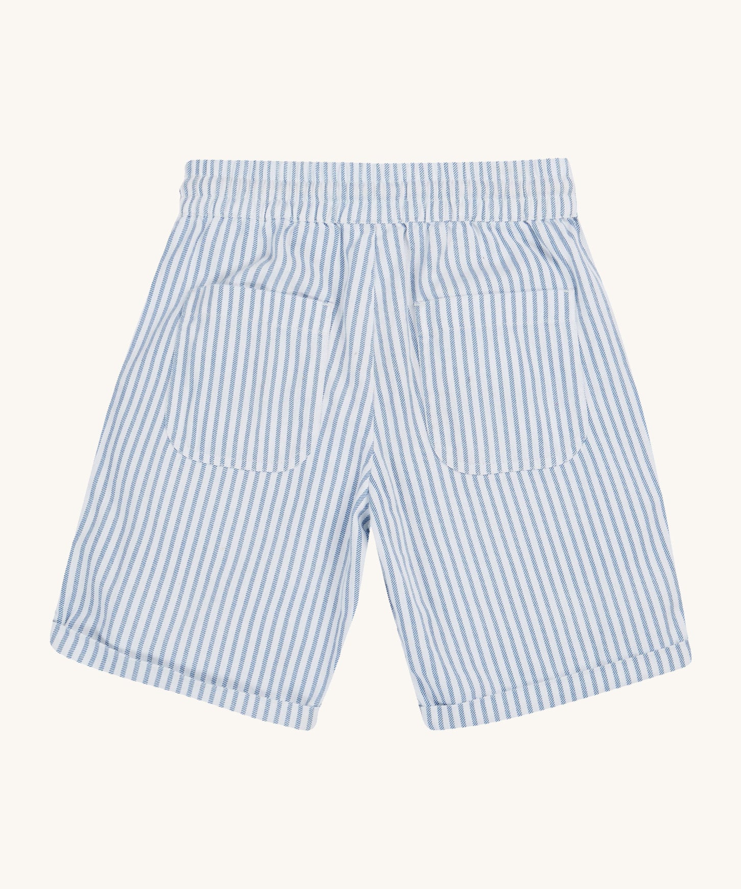 Frugi blue and white striped shorts back detail on a cream background.