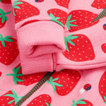 Frugi kids snuggle suit in strawberry design arm cuff detail