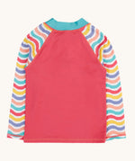 Back of the Frugi recycled plastic rash vest laid flat. In light pink with a pastel wavy striped design on the long sleeves 