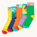 Frugi adventure themed multipack socks laid flat in different colours and designs