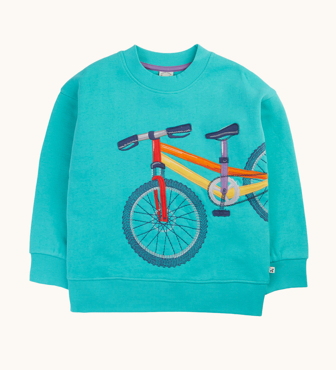 Frugi organic cotton sweatshirt laid flat. In light blue with a bike design wrapped from the front to the side.