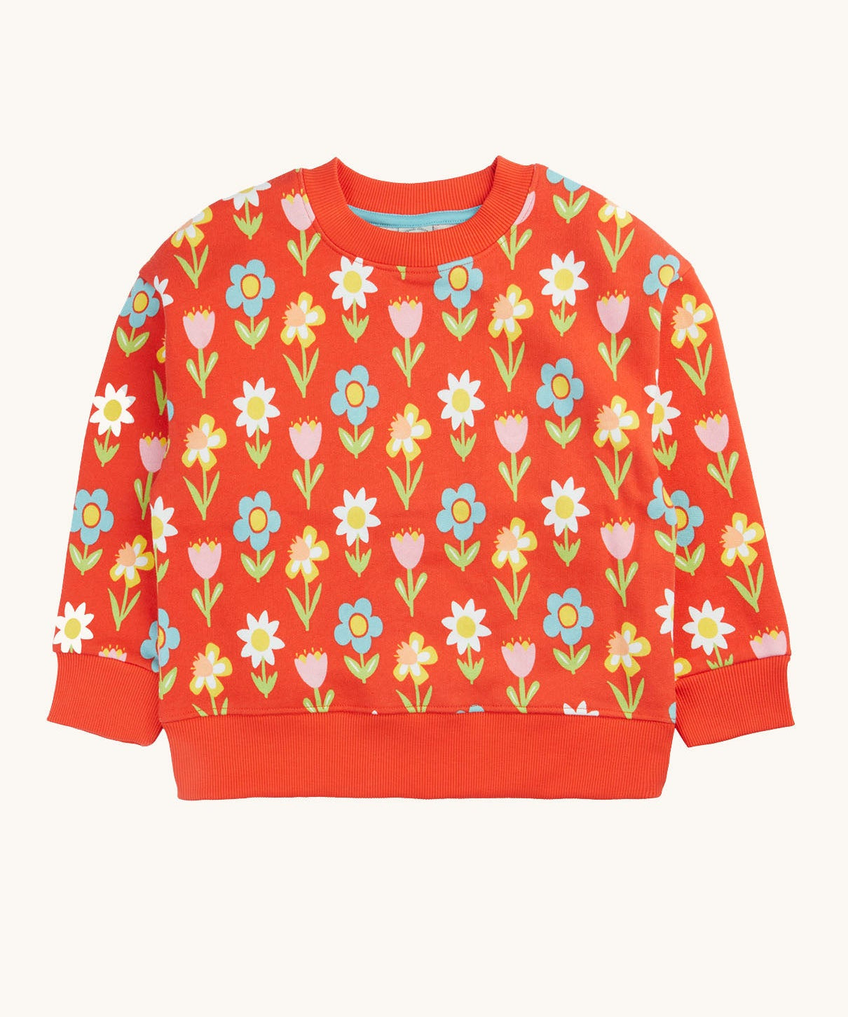 Frugi organic cotton sweatshirt laid flat. In red with a repeating pastel coloured flower print.