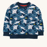Frugi organic cotton sweatshirt laid flat. In dark blue and navy trim with a repeating grey manta ray and shark print.