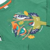 A close up of the Frugi kids terrific applique top in holly green/birds showing the neck and applique detail on dark green organic cotton fabric.