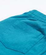 Frugi kids trousers in green, blue, turquoise colour back pocket detail