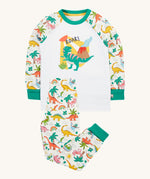 Frugi white pyjama set dinoland design on a cream background.