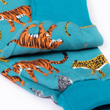 A close up of the fold-able cuffs on the Frugi Organic Cotton blue wild cats print Children's Big Snuggle Suit. This all in one snuggle suit is a part of a wide range of organic cotton clothing for children available here at Babipur. 