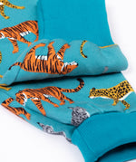 A close up of the fold-able cuffs on the Frugi Organic Cotton blue wild cats print Children's Big Snuggle Suit. This all in one snuggle suit is a part of a wide range of organic cotton clothing for children available here at Babipur. 