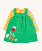 Frugi yellow stripe green spots pinafore outfit lady bird design on a cream background.