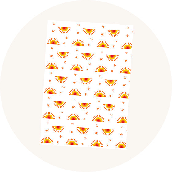Babipur Sun Wrapping Paper, gift wrap using vegetable based inks with repeat sun, swirls and stars pattern. 