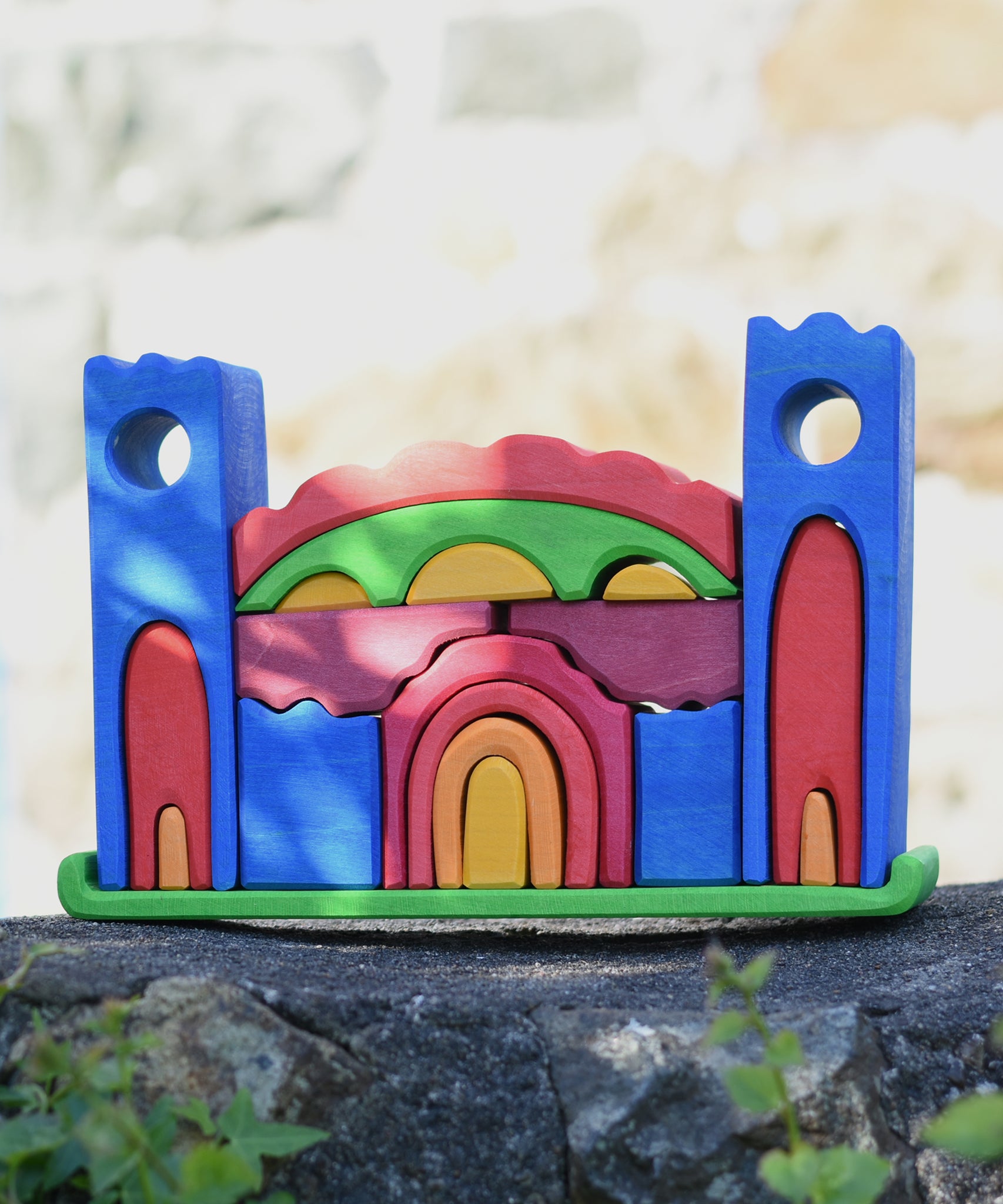 Gluckskafer blue castle block set fully set up and standing on a stone wall