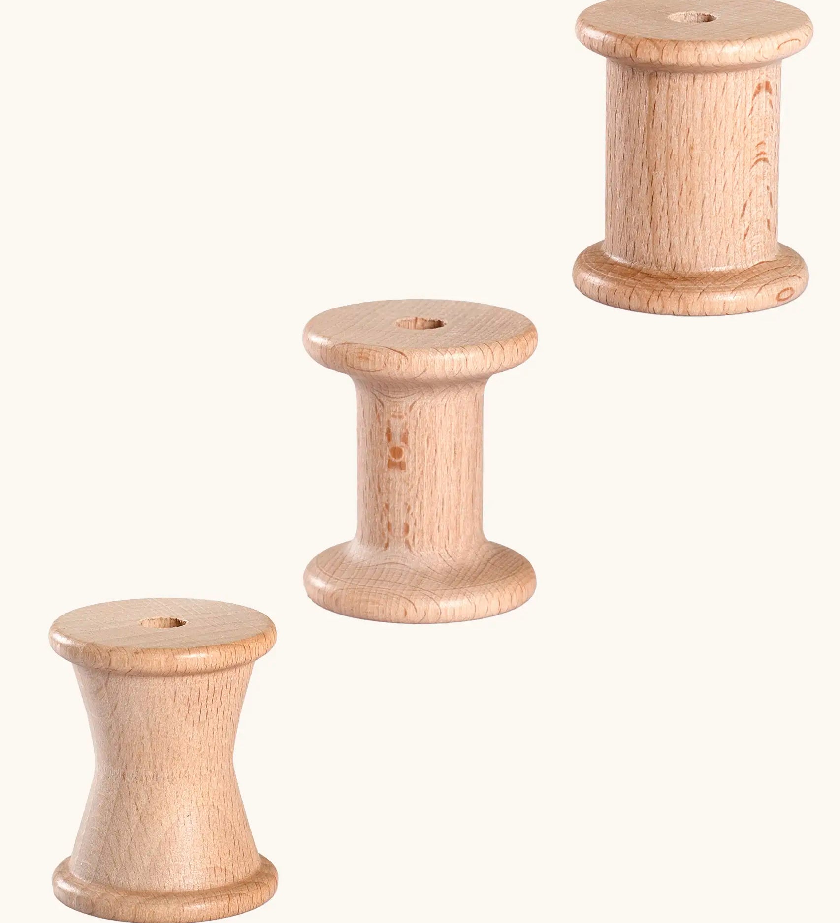 Set of 3 Grapat handcrafted wooden spools. Each spool has a different shape