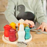 A handcrafted wooden Grapat 7 moons weekly calendar set standing on a wooden table