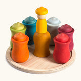 Grapat handcrafted wooden 7 moons weekly calendar set showing curved colour cups and matching peg dolls inside and wooden base