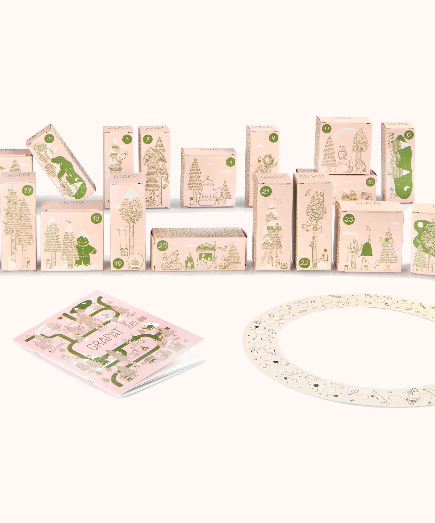 Grapat advent calendar 2025 available at Babipur. Features 24 festive decorative boxes with a cream patterned book and a patterned cardboard circle. 