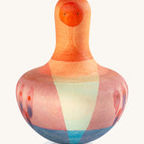 Grapat orange flowing bird - A vibrant tactile wooden orange wobbly bird with hand painted small face with light pint, purple and blue feathers 