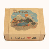 A Autumn inspired illustration on the brown box holding the handmade and hand painted wooden piece from the Grapat x Ostheimer hello Autumn set available at Babipur.