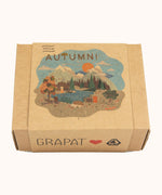 A Autumn inspired illustration on the brown box holding the handmade and hand painted wooden piece from the Grapat x Ostheimer hello Autumn set available at Babipur.