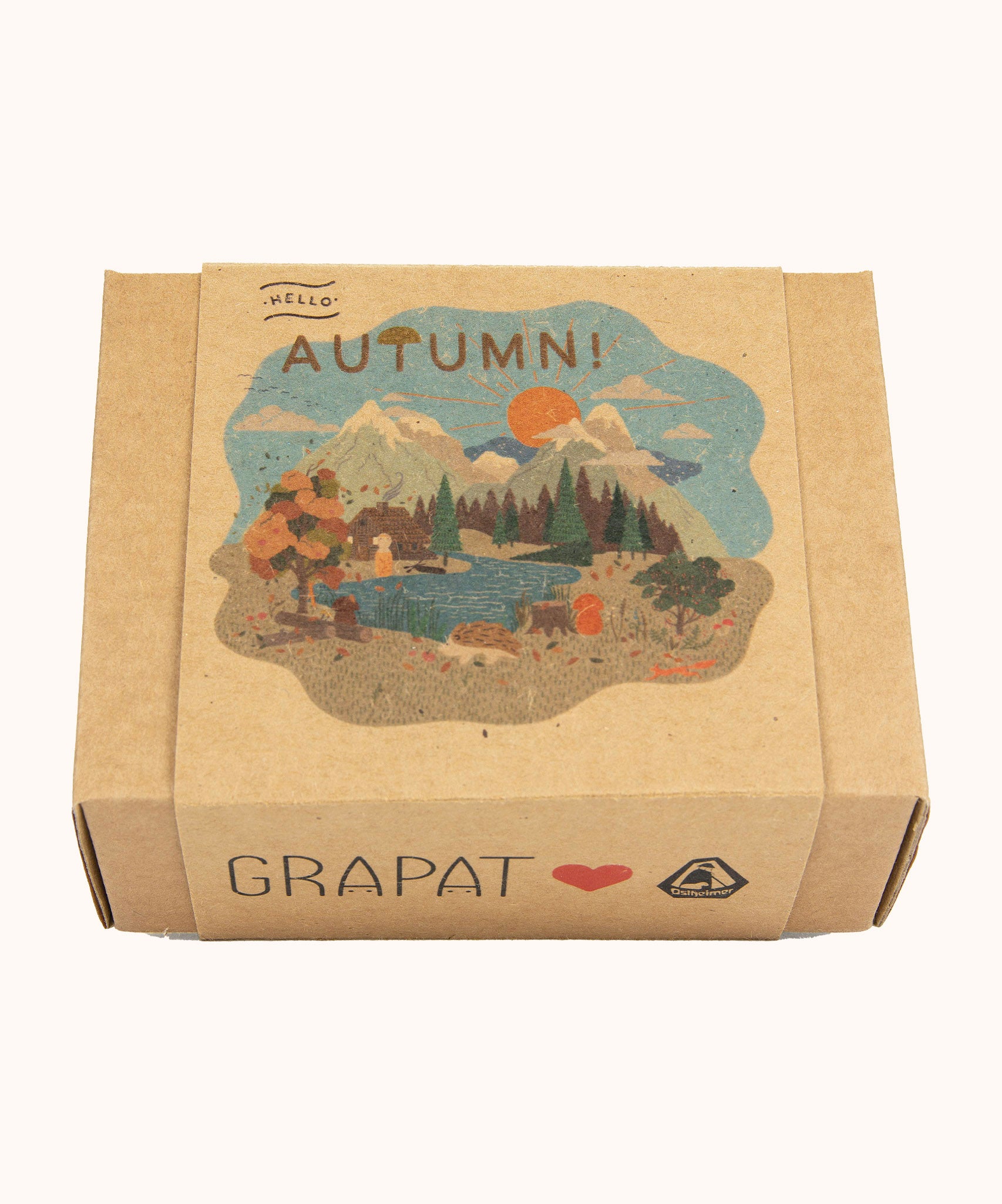 A Autumn inspired illustration on the brown box holding the handmade and hand painted wooden piece from the Grapat x Ostheimer hello Autumn set available at Babipur.