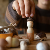 A child playing with the Grapat nin and Ostheimer hedgehog figure from the Grapat Ostheimer hello Autumn set available at Babipur