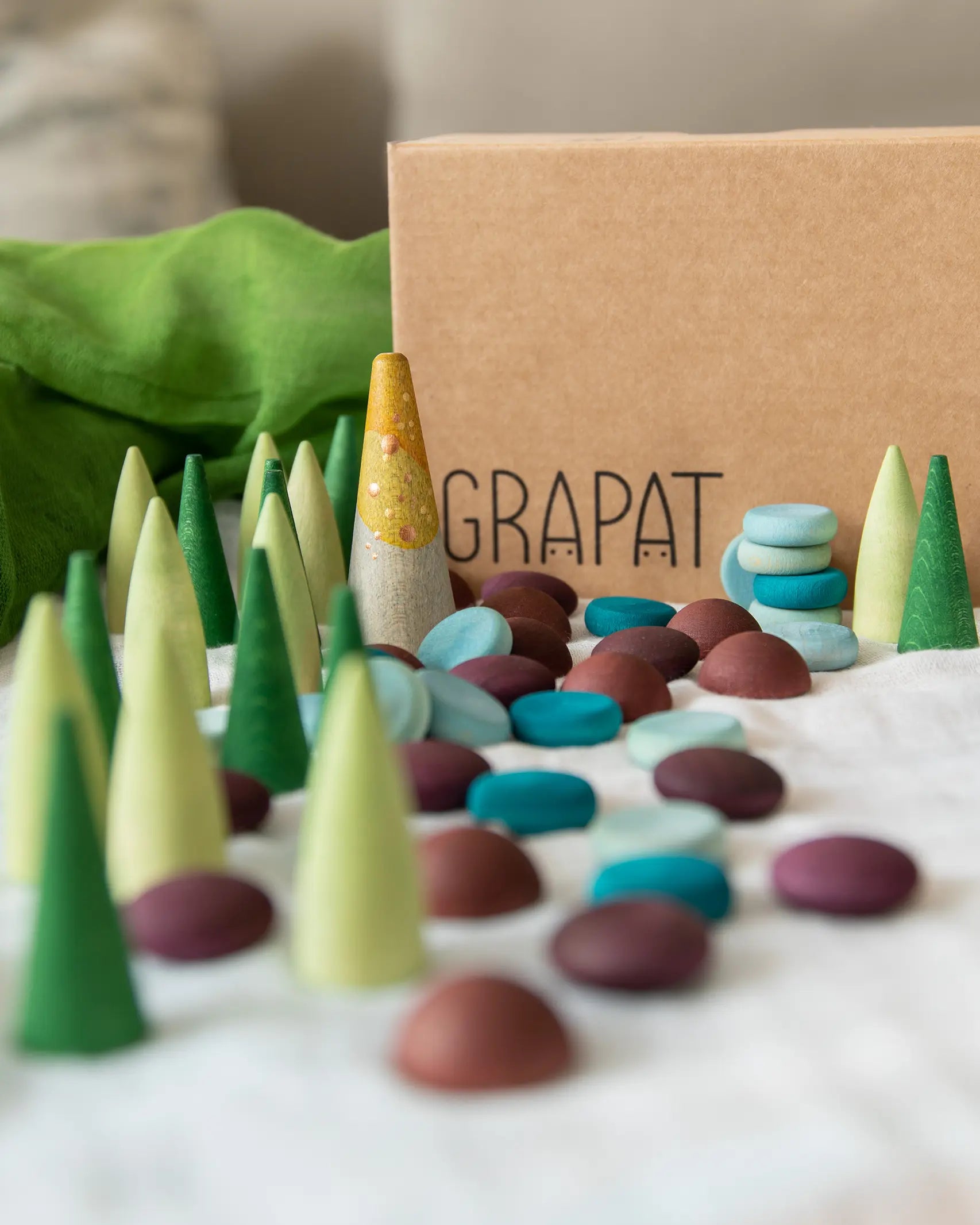 Grapat x Ostheimer Hrókur Horse Mandala Wooden Piece Set of 55 green, blue and burgundy loose parts.