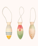 A set of 3 Grapat winter handmade and hand painted sparkle decorations available at Babipur. Each decoration is painted with a festive feel with a thread looping through