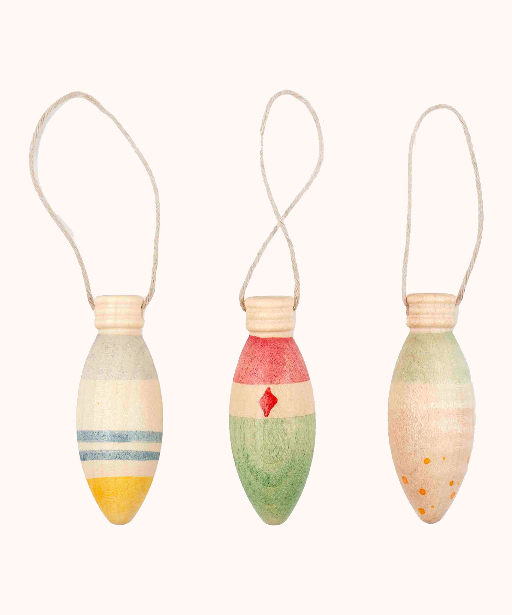 A set of 3 Grapat winter handmade and hand painted sparkle decorations available at Babipur. Each decoration is painted with a festive feel with a thread looping through