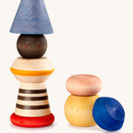Grapat serendipity wooden stacking set - A vibrant wooden stacking set which features 8 different handcrafted wooden shaped pieces ideal for stacking and creative play. Features a brown, light pink, blue yellow orange and striped pieces. 