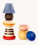 Grapat serendipity wooden stacking set - A vibrant wooden stacking set which features 8 different handcrafted wooden shaped pieces ideal for stacking and creative play. Features a brown, light pink, blue yellow orange and striped pieces. 