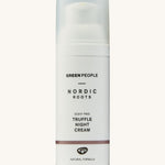 Green People Nordic Roots Truffle Night Cream is in a white tube, with a small purple/brown stripe at the bottom and is on a cream background