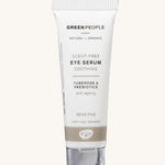 The Green People Scent Free Eye Serum is soothing for sensitive skin, organic, and anti-ageing. The cream is in a white tube with a silver lid and a light brown stripe. The image is on a cream background