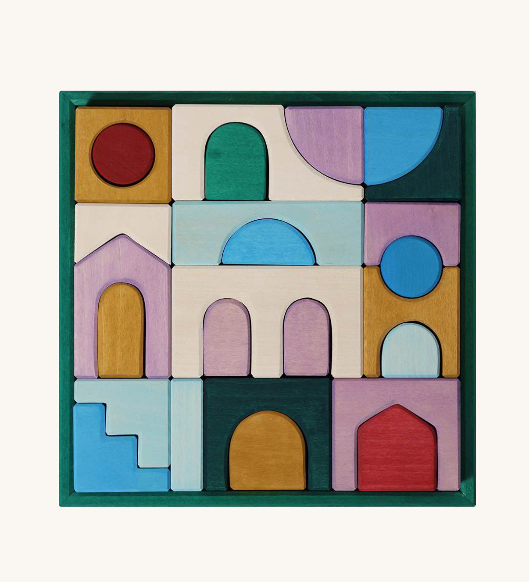 Grimm's wooden floor building set in a purple square frame shows handcrafted pieces in different colours