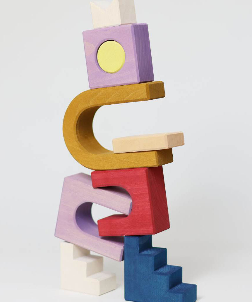 Close up of stack made from different Grimm's wooden panorama building set pieces 