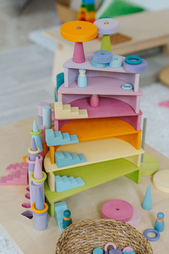 Grimm's Tower made with a rainbow semi circles and stepped roofs to represent Grimm's Wooden Rainbows and Building Block Sets for sale at Babipur, official UK stockist.