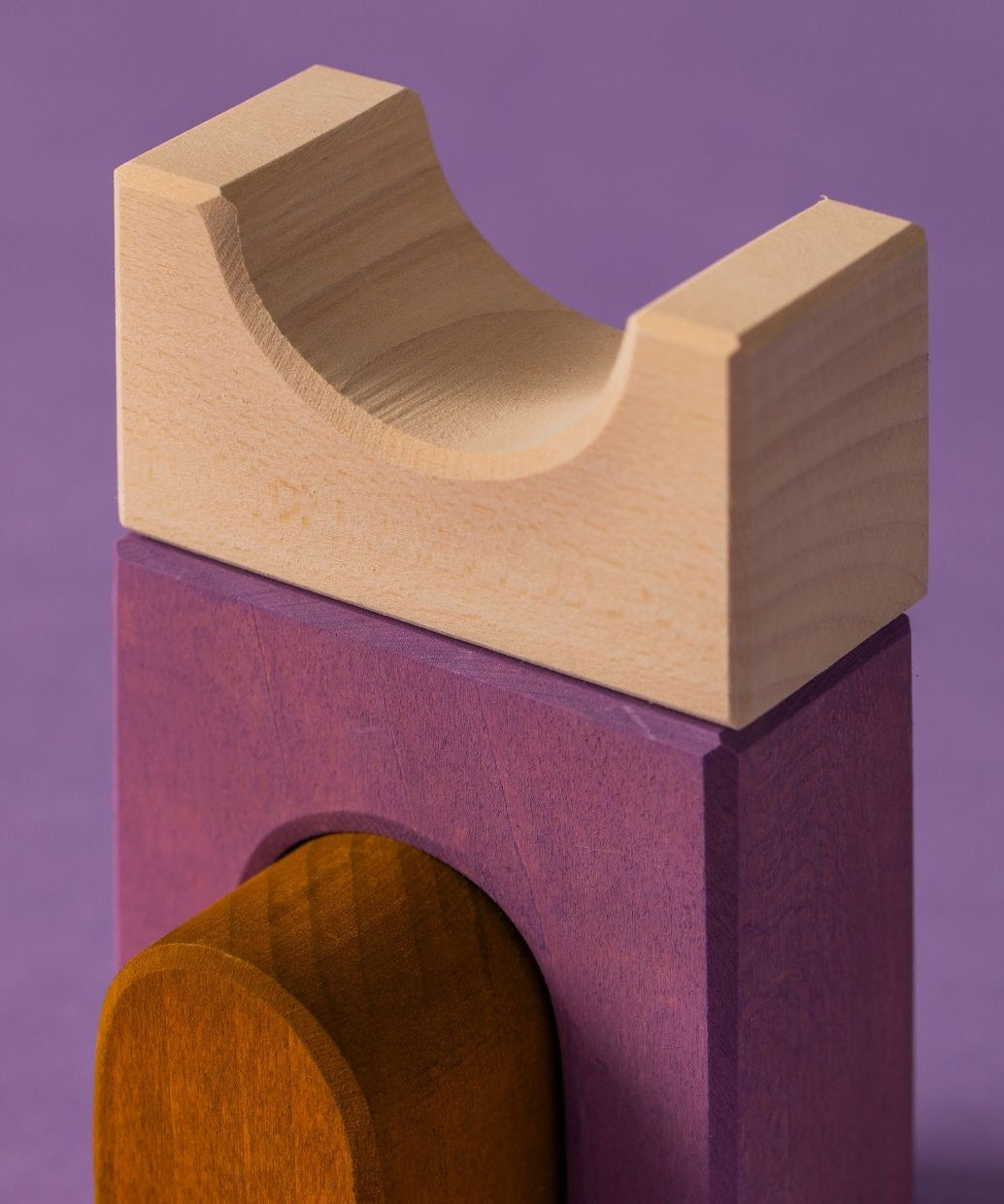 Close up of a white tactile piece from the Grimm's wooden panorama building set, shows hand carved detail