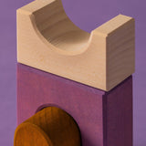 Close up of a white tactile piece from the Grimm's wooden panorama building set, shows hand carved detail