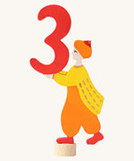 Grimms number 3 fairy decorative figure available at Babipur. A red wooden number 3 figure with a king holding the number