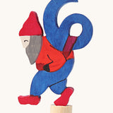 Grimms number 6 fairy decorative figure available at Babipur. A blue wooden number 6 figure on top of a red dwarf