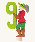 Grimms number 9 fairy decorative figure available at Babipur. A green wooden number 9 figure with fairytale person latching on.