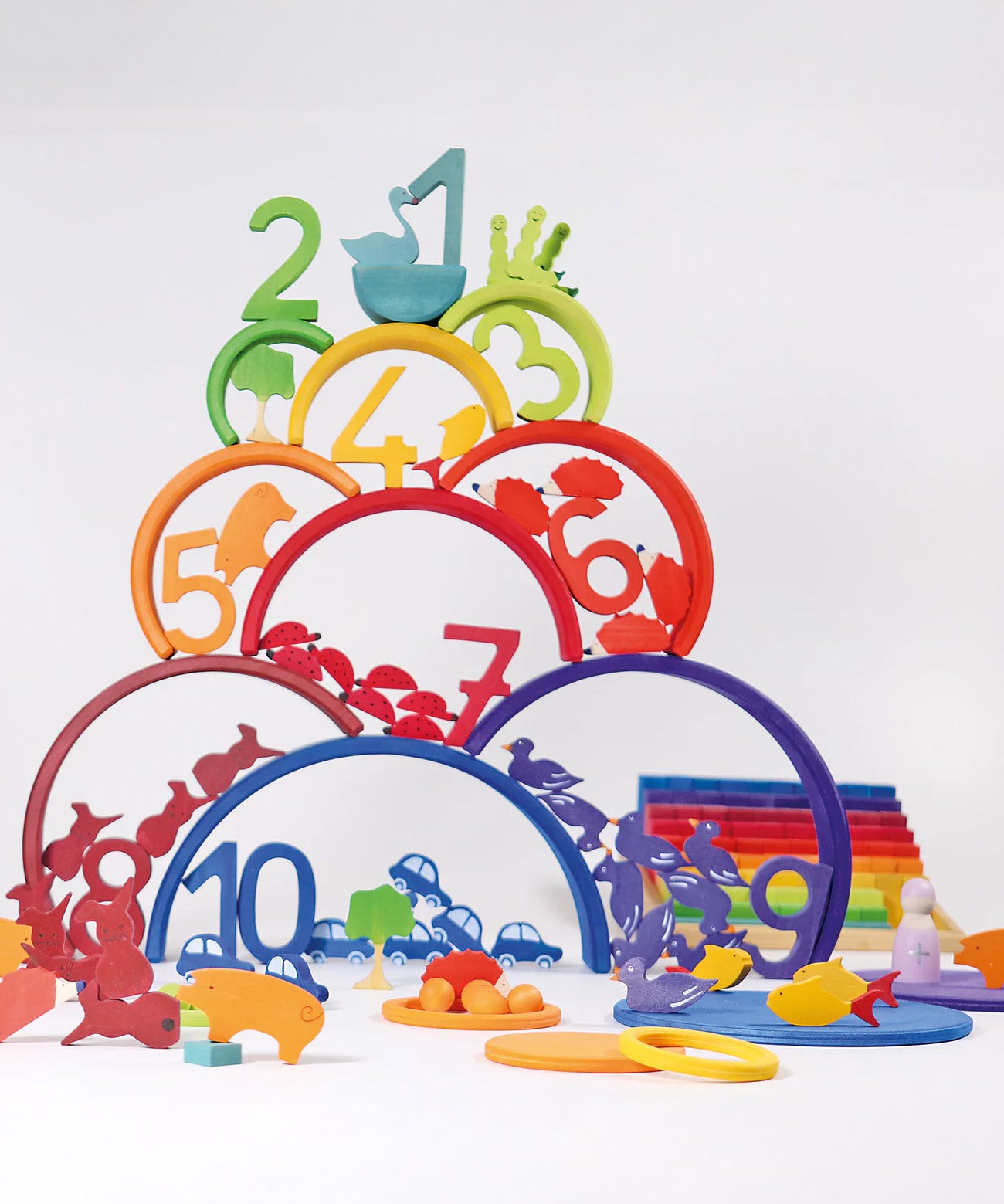 A rainbow coloured inspired stack including various wooden figures from the Grimms counting and story telling set. This set is available at Babiur