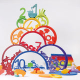 A rainbow coloured inspired stack including various wooden figures from the Grimms counting and story telling set. This set is available at Babiur
