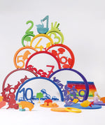 A rainbow coloured inspired stack including various wooden figures from the Grimms counting and story telling set. This set is available at Babiur