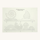 A page from the Grimms little rainbow colouring book available at Babipur showing an example page with the different rainbows and sets on a shelf