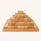 Grimm's Natural Large Stepped Pyramid in a wooden storage display tray.