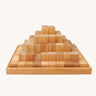 Grimm's Natural Large Stepped Pyramid in a wooden storage display tray.